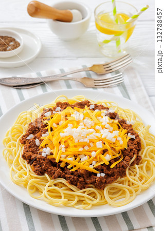 Cincinnati chili with spaghetti on white plate 132788457