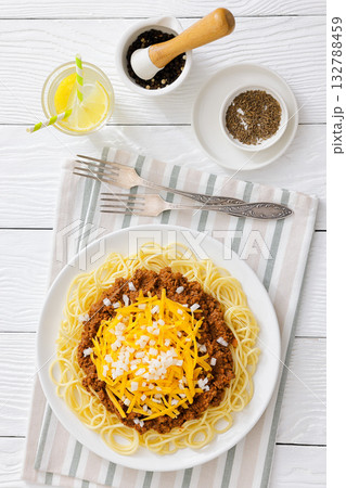 Cincinnati chili with spaghetti on white plate 132788459