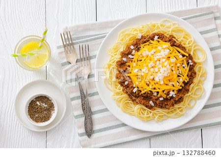 Cincinnati chili with spaghetti on white plate 132788460