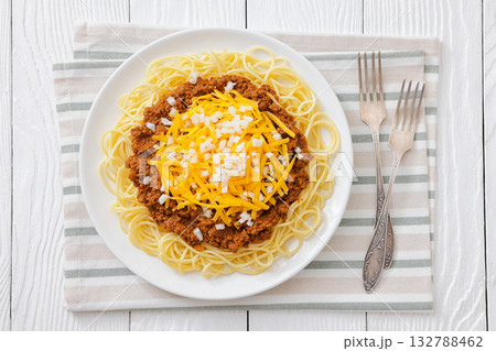 Cincinnati chili with spaghetti on white plate 132788462