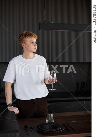 Gentle scene of solitary tasting at minimalist table setting 132789138