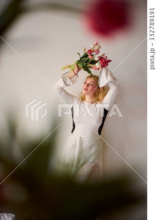 white woman as floral muse with tulips, dreamlike portrait 132789191