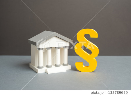 Bank building and paragraph symbol. Court and laws. Financial regulation, fiscal service. Financial control, taxation, government supervision. Finance regulation, economic policy, fiscal governance. 132789659