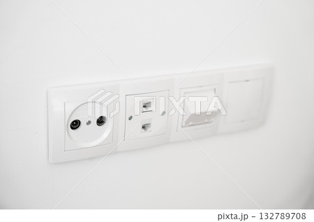 White electrical wall sockets for TV, internet, and communication cables White electrical wall sockets for TV, internet, and communication cables 132789708