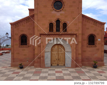 Historic church facade in Tenerife village. Religious devotion, Spanish heritage, and architectural beauty of the Canary Islands. Historic church facade in Tenerife village. Religious devotion, Spanish heritage, and architectural beauty of the Canary Islands. 132789799