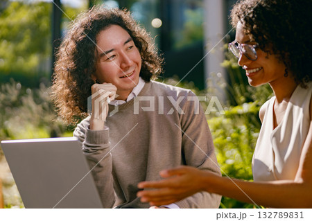 person instructing and learner reviewing strategies in natural outdoor environment with engaged person instructing and learner reviewing strategies in natural outdoor environment with engaged 132789831
