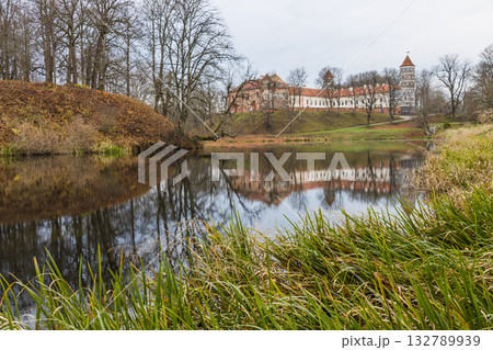 Historic castle and manor reflected in calm lakeside wate Historic castle and manor reflected in calm lakeside wate 132789939