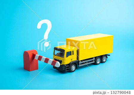 The truck is stopped by a closed barrier. Refusal of transit of cargo. Logistics problems. Supply chain crises, and bureaucratic obstacles. Customs delays, trade restrictions, and export problems. The truck is stopped by a closed barrier. Refusal of transit of cargo. Logistics problems. Supply chain crises, and bureaucratic obstacles. Customs delays, trade restrictions, and export problems. 132790048
