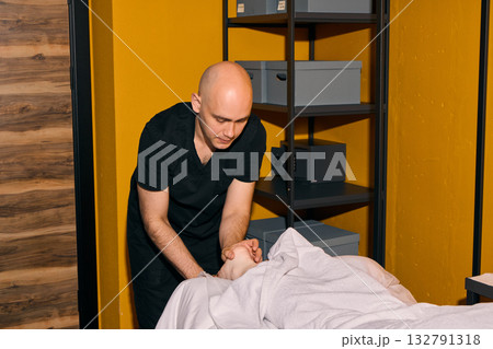 Professional Massage Therapy Session Offered in a Relaxing and Tranquil Setting Ideal for You 132791318