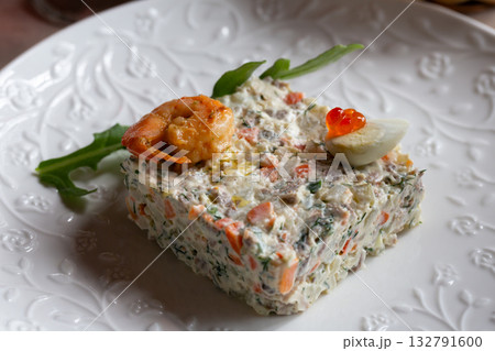 Olivier salad, vinaigrette salad and tartlets. Traditional russian appetizer for celebrating new year eve. Festive table setting. Olivier salad, vinaigrette salad and tartlets. Traditional russian appetizer for celebrating new year eve. Festive table setting. 132791600