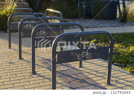 Empty bicycle parking lot in a city park. 132791645