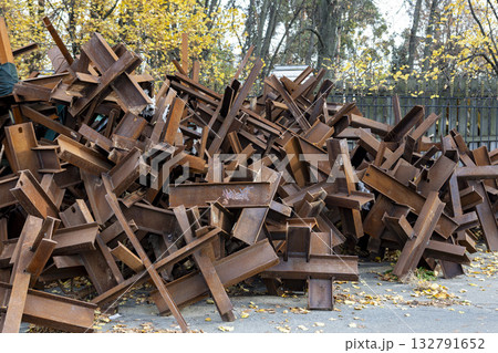 A lot of antitank obstacles Czech hedgehogs stacked in a pile 132791652