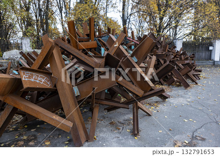 A lot of antitank obstacles Czech hedgehogs stacked in a pile 132791653