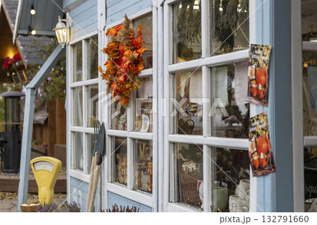 Blue wooden house decorated with autumn decorations, agricultural exhibition, Thanksgiving, Harvest Day Blue wooden house decorated with autumn decorations, agricultural exhibition, Thanksgiving, Harvest Day 132791660