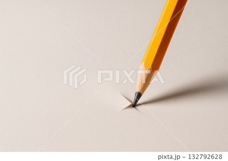 The tip of the pencil pierces the paper. Space for text. The tip of the pencil pierces the paper. Space for text. 132792628