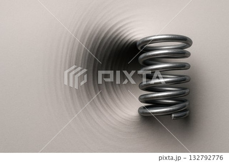 A spring with shadows that create the illusion of depth. Space for text. A spring with shadows that create the illusion of depth. Space for text. 132792776