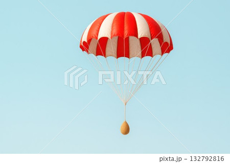 An egg with a parachute descends from the sky. Space for text. 132792816