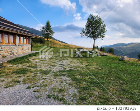 Mountain Refuge with Tree - Alpine Landscape 132792918