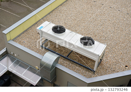 Air conditioning large fans on roof of building view from above Air conditioning large fans on roof of building view from above 132793246