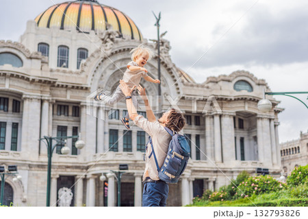 Father tourist lifting his little son in front of Palacio de Bellas Artes in Mexico City, enjoying family travel, playful bonding, and cultural exploration. Family vacation and tourism concept 132793826