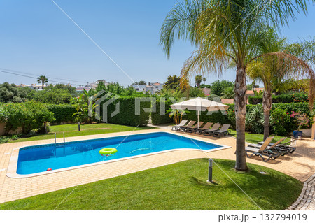 Family pool enjoyment, Enjoyable outdoor setting with pools and recreational zones for families, Vibrant and sunny outdoor environment designed for family fun and water 132794019