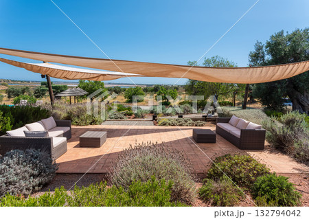 Relaxing outdoor area, Chic patio with comfy furnishings, Elegant openair lounge with stylish decor, Serene outdoor space featuring modern furniture and beautiful scenery Relaxing outdoor area, Chic patio with comfy furnishings, Elegant openair lounge with stylish decor, Serene outdoor space featuring modern furniture and beautiful scenery 132794042