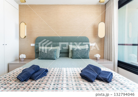 Guestfriendly bedroom featuring modern design and inviting atmosphere, Wellprepared vacation retreat showcasing contemporary styling and thoughtful amenities for guests 132794046