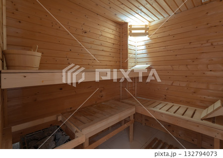 Serene wooden sauna with comfort, Relaxing environment featuring cedarpaneled sauna interior, Warm cedarlined sauna with tiered benches and gentle lighting for peace Serene wooden sauna with comfort, Relaxing environment featuring cedarpaneled sauna interior, Warm cedarlined sauna with tiered benches and gentle lighting for peace 132794073