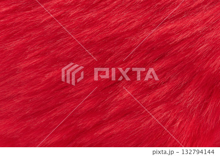 Horizontal photo of red faux fur macro photo as background. 132794144