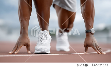 Sprinter prepares to start race on track during a bright day 132794533