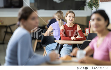 Young woman waiting for her order in cafe Young woman waiting for her order in cafe 132796588