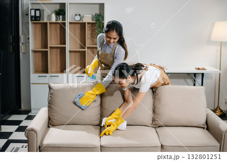 Efficient and professional housekeeping with our dynamic cleaning duo. Perfect teamwork ensures spotless cleanliness 132801251