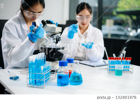 Female Scientists Conducting Chemistry Research in Modern Laboratory 132801976