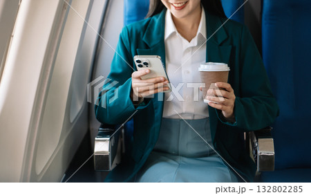 Business woman sitting front tablet ,laptop computer with financial graphs and statistics on monitor Business woman sitting front tablet ,laptop computer with financial graphs and statistics on monitor 132802285