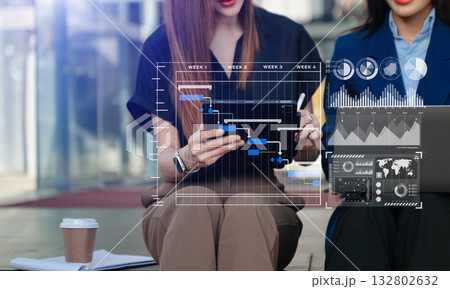 Investor analyzing stock market report and financial dashboard with business intelligence , with key performance indicatorsBusiness team meeting. Investor analyzing stock market report and financial dashboard with business intelligence , with key performance indicatorsBusiness team meeting. 132802632