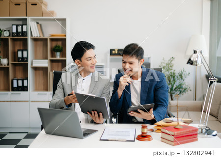 business people and lawyers discussing contract papers sitting at the table. Concepts of law, advice, legal services. business people and lawyers discussing contract papers sitting at the table. Concepts of law, advice, legal services. 132802941