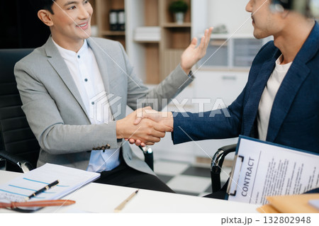 Asian business team and lawyers discussing contract papers sitting at the table. Concepts of law, advice, legal services. 132802948