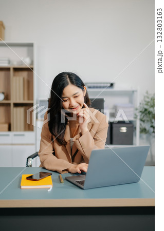 Confident business expert attractive smiling young woman holding digital tablet on desk in office. Confident business expert attractive smiling young woman holding digital tablet on desk in office. 132803163