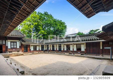 Traditional Korean wooden buildings with tiled roofs form a courtyard at Unhyeongung Palace, a former royal residence showcasing the architecture of the Joseon dynasty in the heart of Seoul 132805609