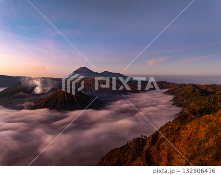 Aerial view Mountains at Bromo volcano during sunrise sky,Beautiful Mountains Penanjakan in Bromo Tengger Semeru National Park,East Java,Indonesia.Nature landscape background Aerial view Mountains at Bromo volcano during sunrise sky,Beautiful Mountains Penanjakan in Bromo Tengger Semeru National Park,East Java,Indonesia.Nature landscape background 132806416