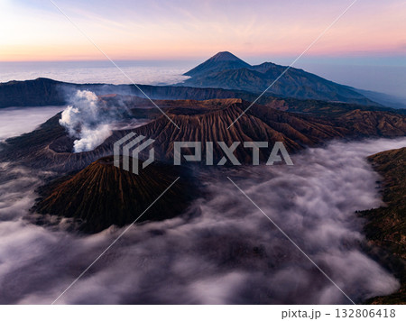 Aerial view Mountains at Bromo volcano during sunrise sky,Beautiful Mountains Penanjakan in Bromo Tengger Semeru National Park,East Java,Indonesia.Nature landscape background Aerial view Mountains at Bromo volcano during sunrise sky,Beautiful Mountains Penanjakan in Bromo Tengger Semeru National Park,East Java,Indonesia.Nature landscape background 132806418