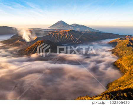 Aerial view Mountains at Bromo volcano during sunrise sky,Beautiful Mountains Penanjakan in Bromo Tengger Semeru National Park,East Java,Indonesia.Nature landscape background Aerial view Mountains at Bromo volcano during sunrise sky,Beautiful Mountains Penanjakan in Bromo Tengger Semeru National Park,East Java,Indonesia.Nature landscape background 132806420