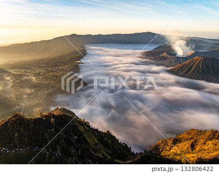 Aerial view Mountains at Bromo volcano during sunrise sky,Beautiful Mountains Penanjakan in Bromo Tengger Semeru National Park,East Java,Indonesia.Nature landscape background Aerial view Mountains at Bromo volcano during sunrise sky,Beautiful Mountains Penanjakan in Bromo Tengger Semeru National Park,East Java,Indonesia.Nature landscape background 132806422