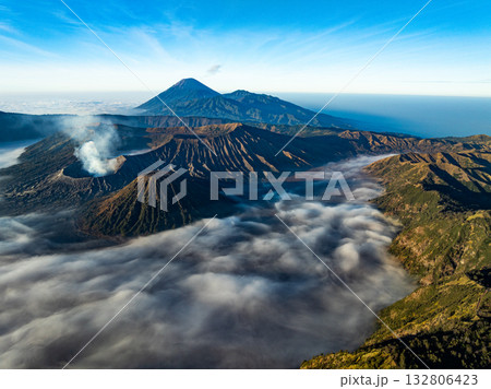 Aerial view Mountains at Bromo volcano during sunrise sky,Beautiful Mountains Penanjakan in Bromo Tengger Semeru National Park,East Java,Indonesia.Nature landscape background Aerial view Mountains at Bromo volcano during sunrise sky,Beautiful Mountains Penanjakan in Bromo Tengger Semeru National Park,East Java,Indonesia.Nature landscape background 132806423