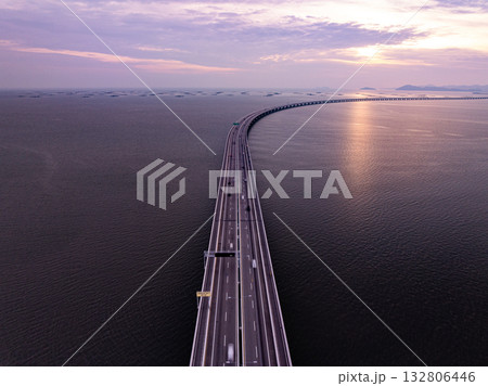 Amazing aerial view of the Penang Bridge in sunset or sunrise sky background Amazing aerial view of the Penang Bridge in sunset or sunrise sky background 132806446