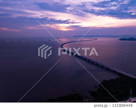 Amazing aerial view of the Penang Bridge in sunset or sunrise sky background 132806449