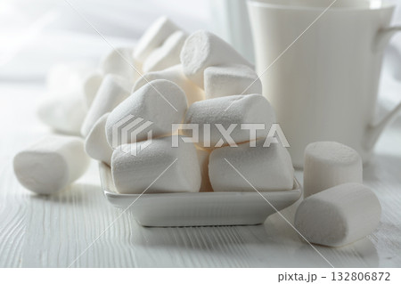 White marshmallows on a wooden table. 132806872