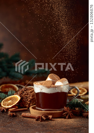 Hot chocolate with marshmallows sprinkled with cocoa powder. 132806876