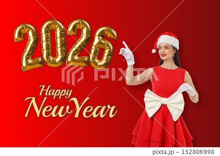 Woman in a red dress with a white bow wears a Santa hat 132806998