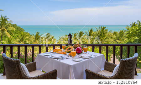 A romantic breakfast on a balcony or terrace with stunning panoramic views 132810264